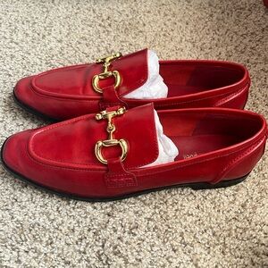 Jeffrey Campbell cherry red leather loafers with gold tone horsebit.